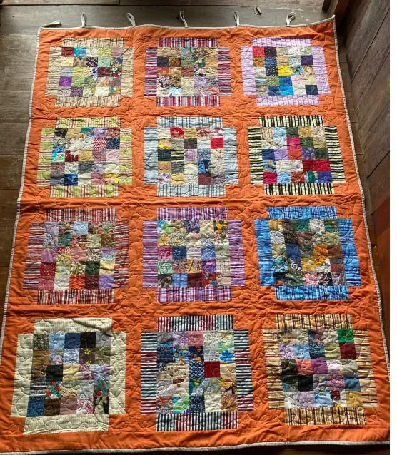 Inset pattern orange border quilt